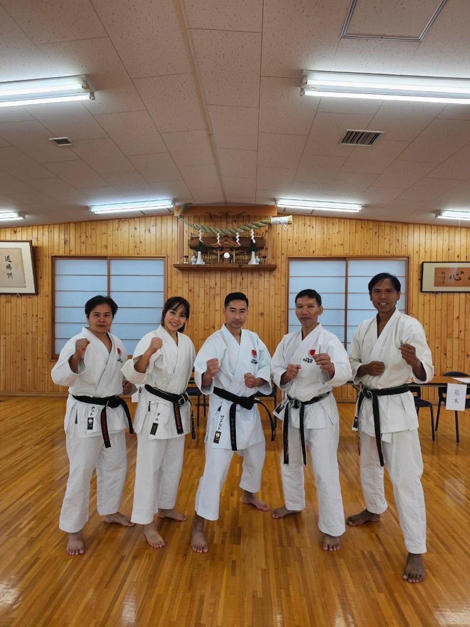 Five Thai black belts at the JKA headquarters dojo in Japan