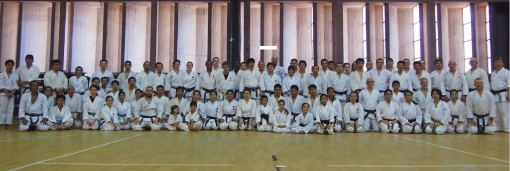 Group photo of participants in a large hall